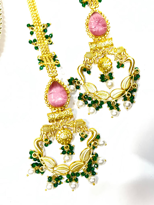 Brass chandbalis with pink stones, green pearl drops & trailing back chain. Lightweight festive elegance.